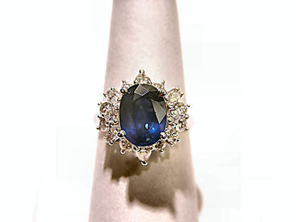 OVAL BLUE SAPPHIRE SET WITH ROUND BRILLIANT MARQUISE