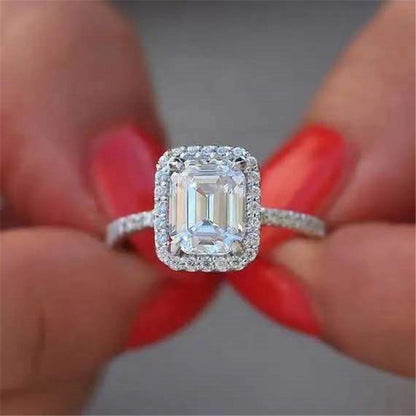 Emerald Cutter Proposes and Engages Moissanite Diamond Ring