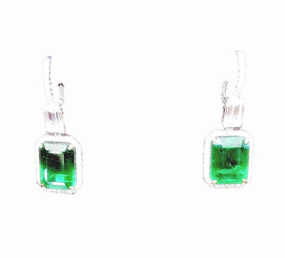 EMERALD 2 EMERALD SHAPE DIAMOND EMERALD SHAPE AND ROUND DROP HALO