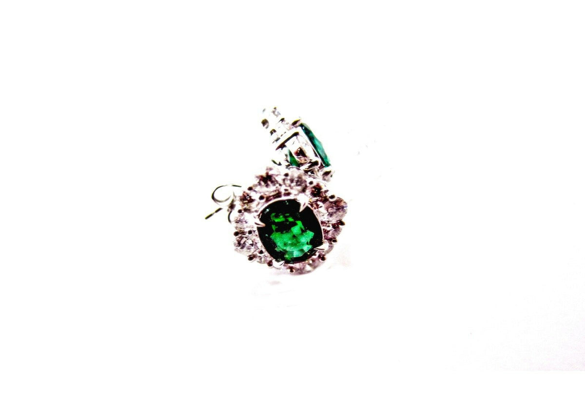 emerald two oval set triangular halo stud earring
