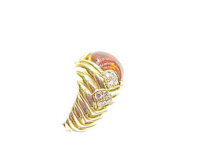 CABOCHON CITRINE SET WITH SIXTEEN ROUND BRILLIANT SHAPE DIAMOND