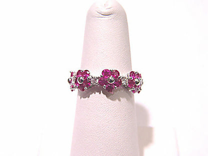 GEMSTONE ARE SET ALL THE WAY AROUND THE BAND ETERNITY BAND