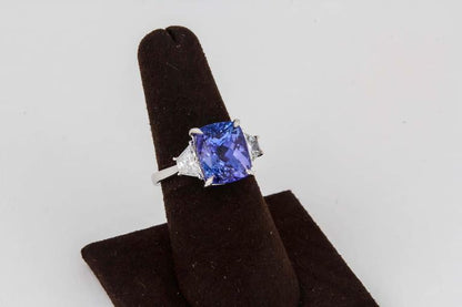 8.02 CT TANZANITE CUSHION CUT SET .75 CT TRAPEZOID TANZANITE DIAMOND RING 18 K