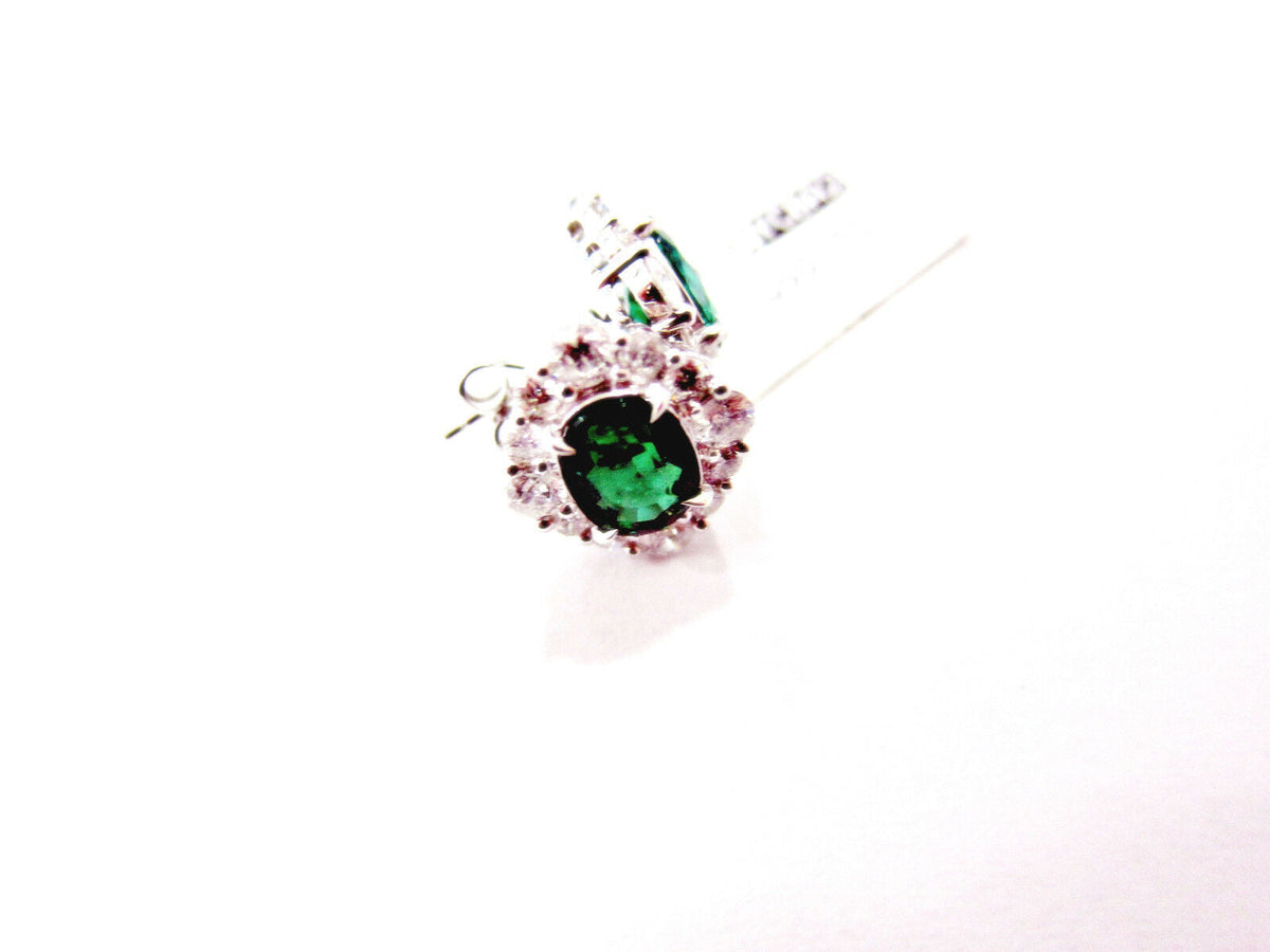 emerald two oval set triangular halo stud earring