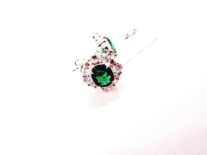 emerald two oval set triangular halo stud earring