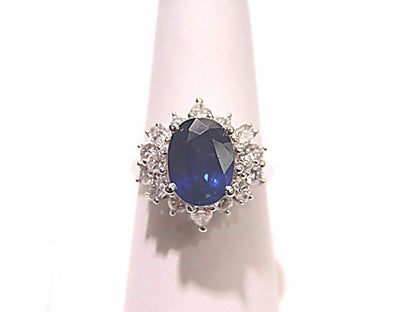 OVAL BLUE SAPPHIRE SET WITH ROUND BRILLIANT MARQUISE