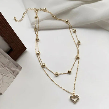 Gold Double Heart Necklace with Diamonds