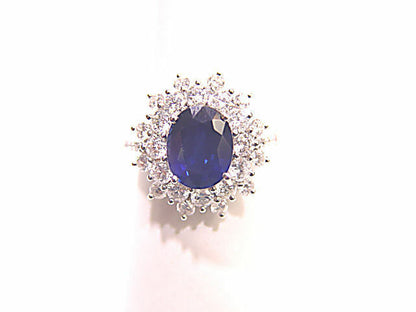 OVAL SAPPHIRE SET WITH ROUND BRILLIANT CUT DIAMONDS RING