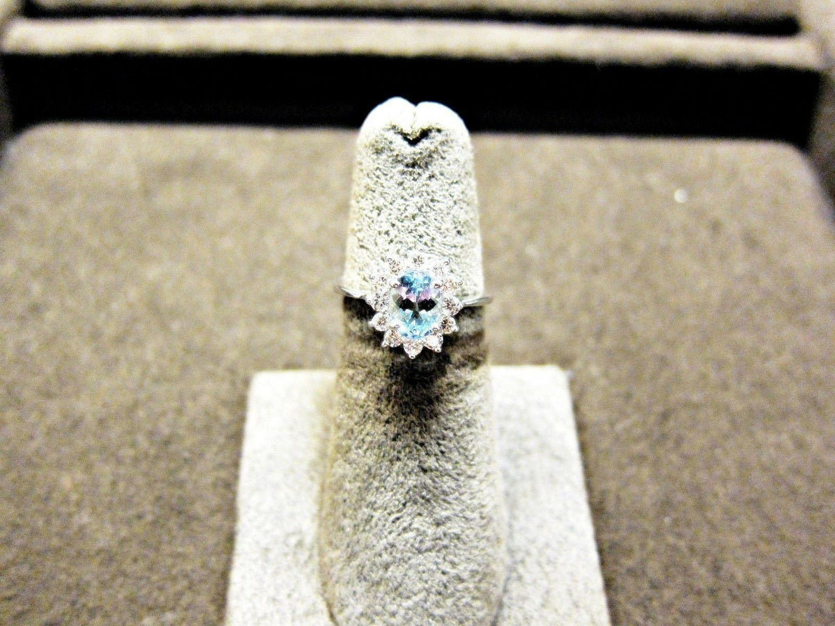 OVAL AQUAMARINE SET ROUND BRILLIANT SHAPE DIAMOND ROUND