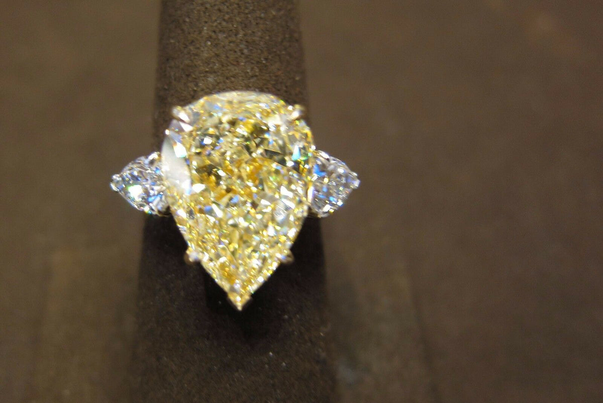 GIA CERTIFIED FANCY LIGHT YELLOW PEAR SHAPE SI2 SIDE PEAR ENGAGEMENT RING