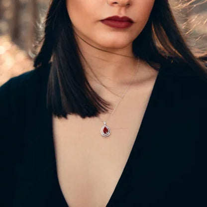Allura Ruby and 0.22 CT. T.W. Diamond Teardrop Halo Pendant in 18K White Gold