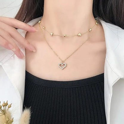 Trendy High-End Gold Double Heart Necklace with Diamonds