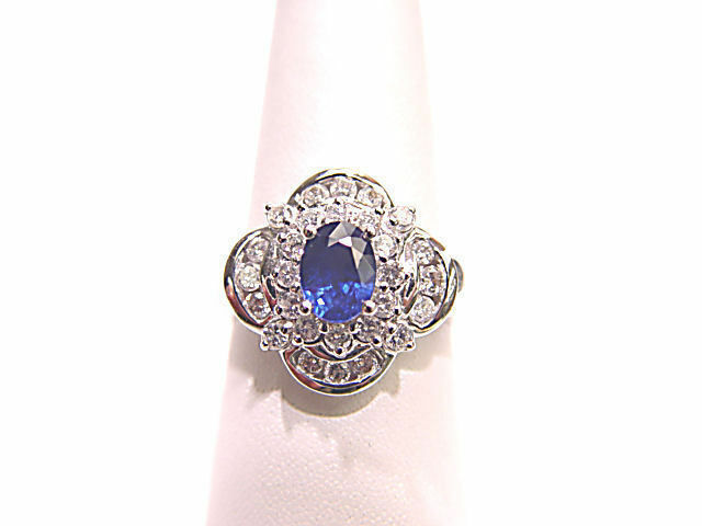 OVAL SAPPHIRE SET WITH ROUND BRILLIANT CHANNEL SET