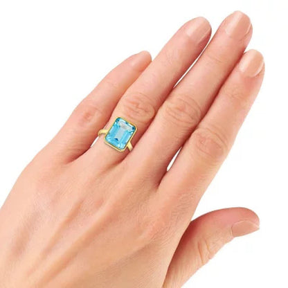 Sky Blue Topaz Emerald Shaped Ring in 14 Karat Yellow Gold