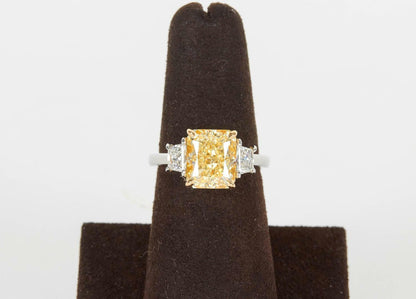 GIA FANCY LIGHT YELLOW 4.01 CT RADIANT VVS1 CLARITY GRADE .58 CT SIDE TRAPEZOID