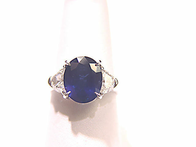 ONE OVAL BLUE SAPPHIRE SET WITH TWO HALF MOON DIAMONDS RING SAPPHIRE AND DIAMOND
