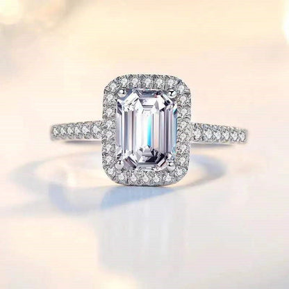 Emerald Cutter Proposes and Engages Moissanite Diamond Ring