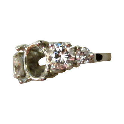 Diamond setting and two and two round brilliant shape diamond engagement setting