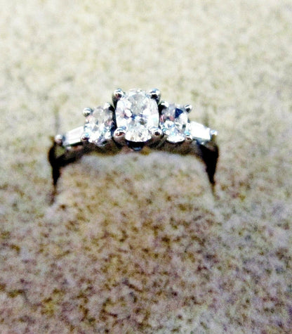 DIAMOND THREE OVAL CENTER SET SIDE TWO TAPERED BAGUETTE SHAPE ENGAGEMENT RING