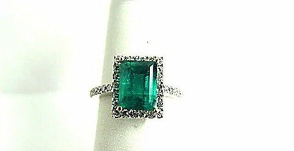 EMERALD GREEN RECTANGLE SHAPE 9.14X 6.92X 5.33MM DIAMOND