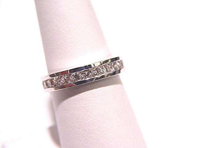 DIAMOND CHANNEL SET ALL THE WAY AROUND THE BAND ETERNITY