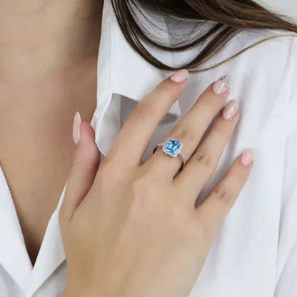 Blue Topaz and 0.14 CT. T.W. Diamond Ring in Sterling Silver