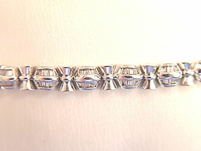 BAGUETTE SHAPE DIAMOND CHANNEL SET WITH GOLD BARS IN-BETWEEN DIAMOND