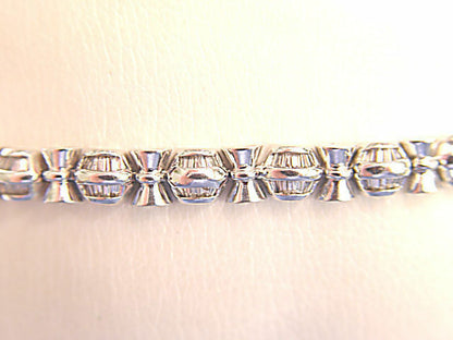 BAGUETTE SHAPE DIAMOND CHANNEL SET WITH GOLD BARS IN-BETWEEN DIAMOND