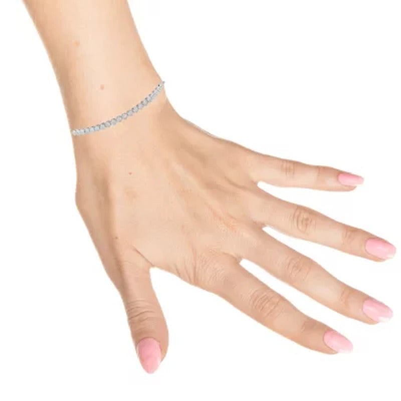 Sterling Silver and 0.25 CT. T.W. Diamond Tennis Style Bolo Bracelet