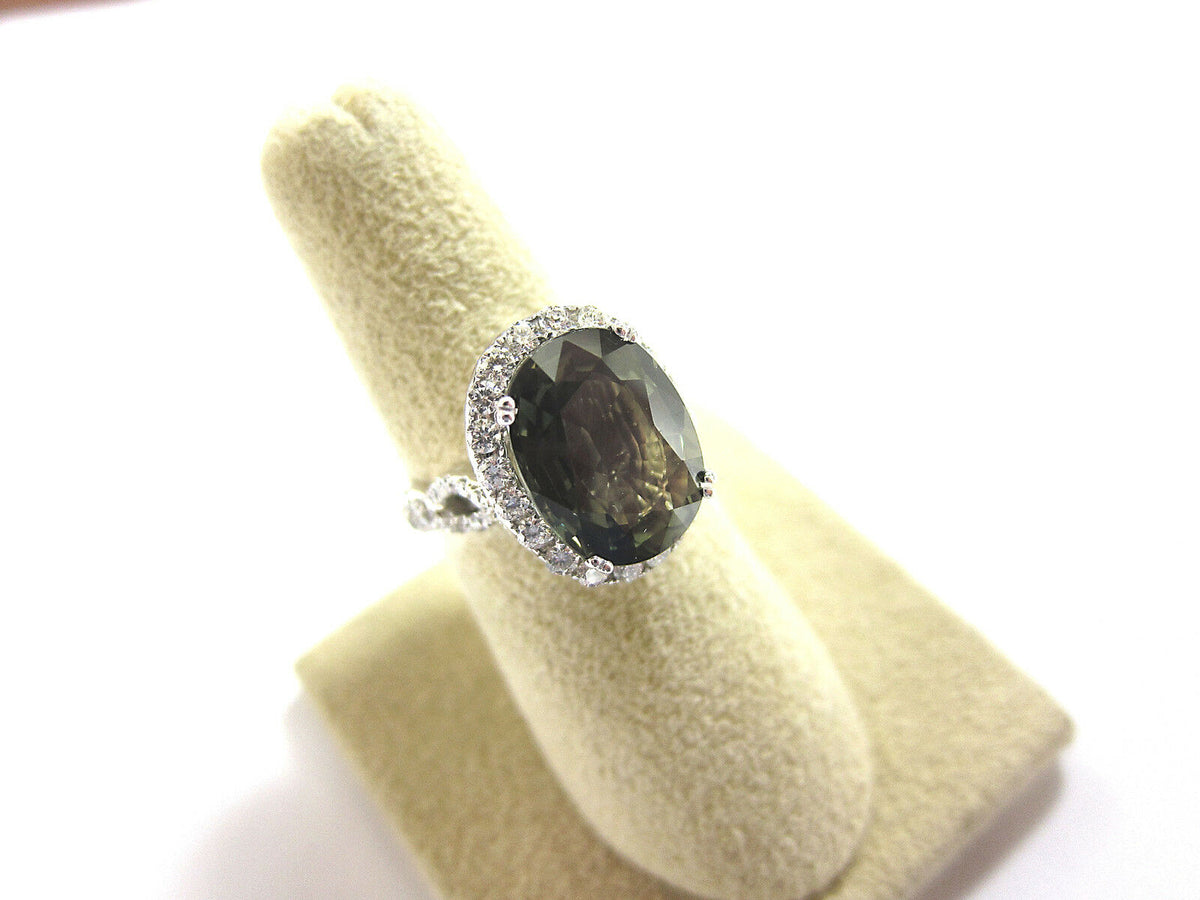 CERTIFIED GREEN SAPPHIRE OVAL FACETED 13.95X10.68X5.37MM SET ROUND DIAMOND HALO