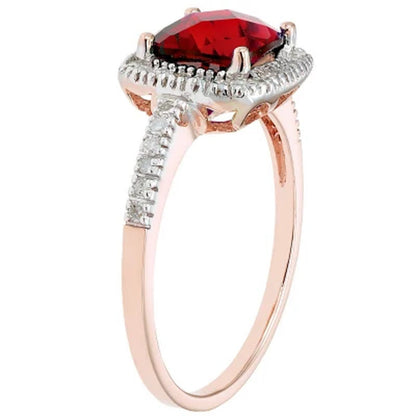 Lab Ruby and 0.18 CT. T.W. Diamonds in 14K Gold