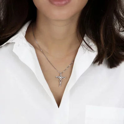 Dancing Created White Sapphire and 0.15 CT. T.W. Diamond Cross Pendant in Sterli