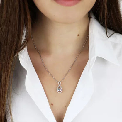 Dancing Aquamarine and 0.12 CT. T.W. Diamond Infinity Pendant in Sterling Silver
