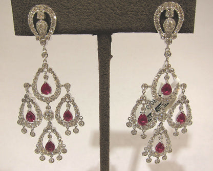 RUBY PEAR SHAPE EIGHT STONE SET WITH WHITE ROUND BRILLIANT