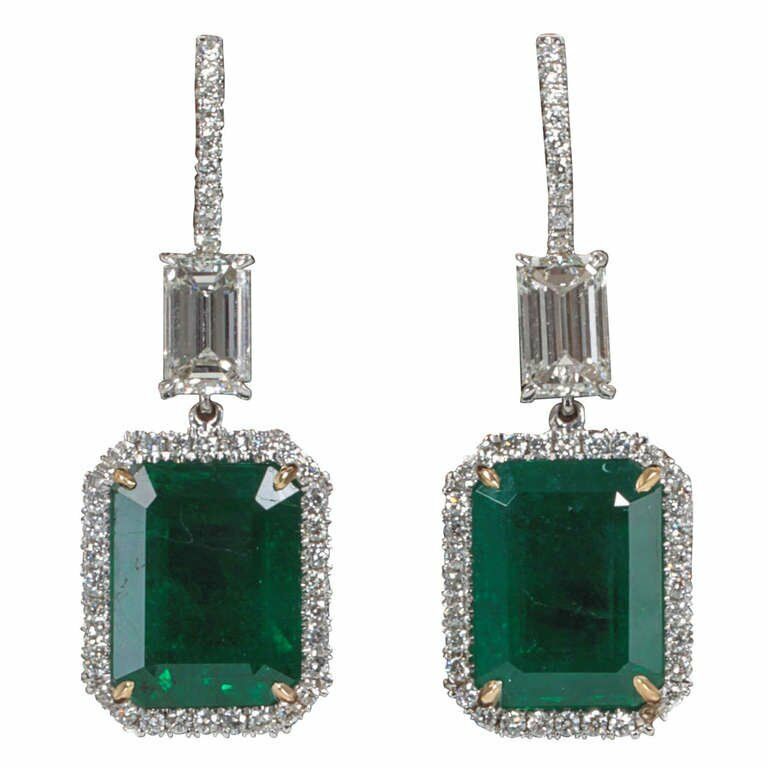 EMERALD 2 EMERALD SHAPE DIAMOND EMERALD SHAPE AND ROUND DROP HALO