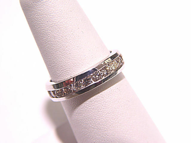 DIAMOND SET ALL THE WAY AROUND THE BAND ETERNITY CHANNEL SET