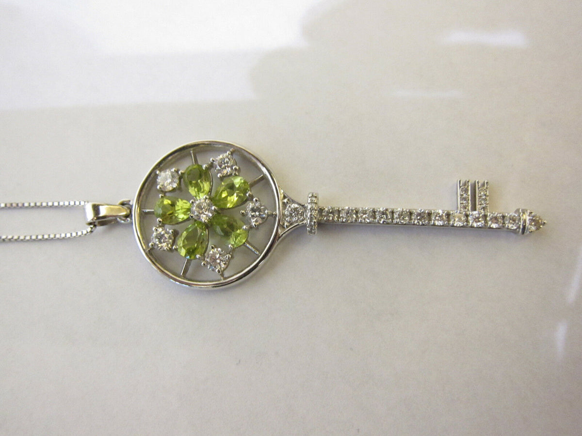 PERIDOT PEAR SHAPE AND DIAMOND ROUND BRILLIANT KEY PENDANT