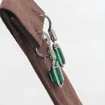 EMERALD 2 EMERALD SHAPE DIAMOND EMERALD SHAPE AND ROUND DROP HALO