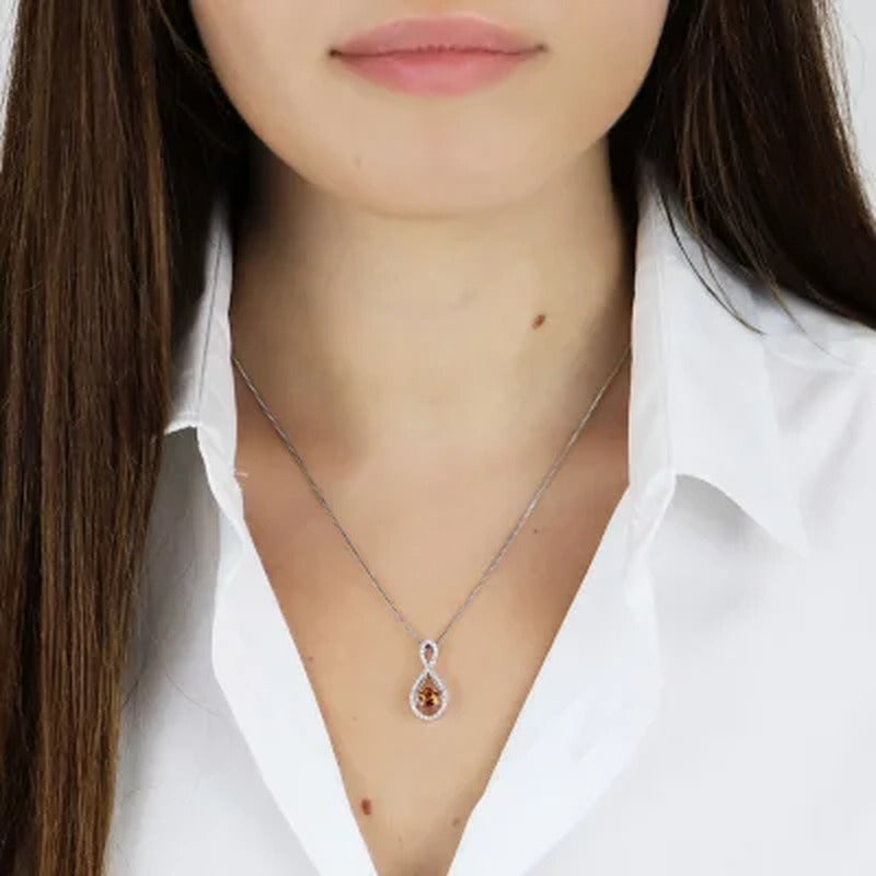Dancing Genuine Citrine and 0.12 CT. T.W. Diamond Infinity Pendant in Sterling S