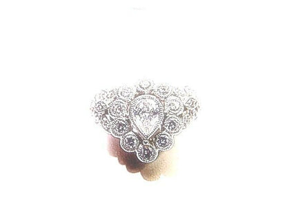 CENTER PEAR CUT DIAMOND SIDE ROUND BRILLIANT CUT DIAMOND COCKTAIL RING BAND