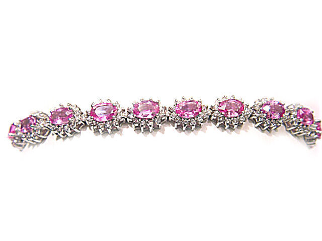 17 OVAL PINK SAPPHIRES SET WITH ROUND BRILLIANT CUT DIAMONDS