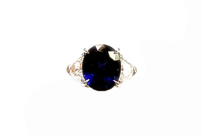 ONE OVAL BLUE SAPPHIRE SET WITH TWO HALF MOON DIAMONDS RING SAPPHIRE AND DIAMOND