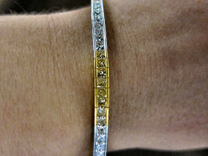 Fancy yellow 6.60 CT diamond 32 piece princess white diamond 18 K