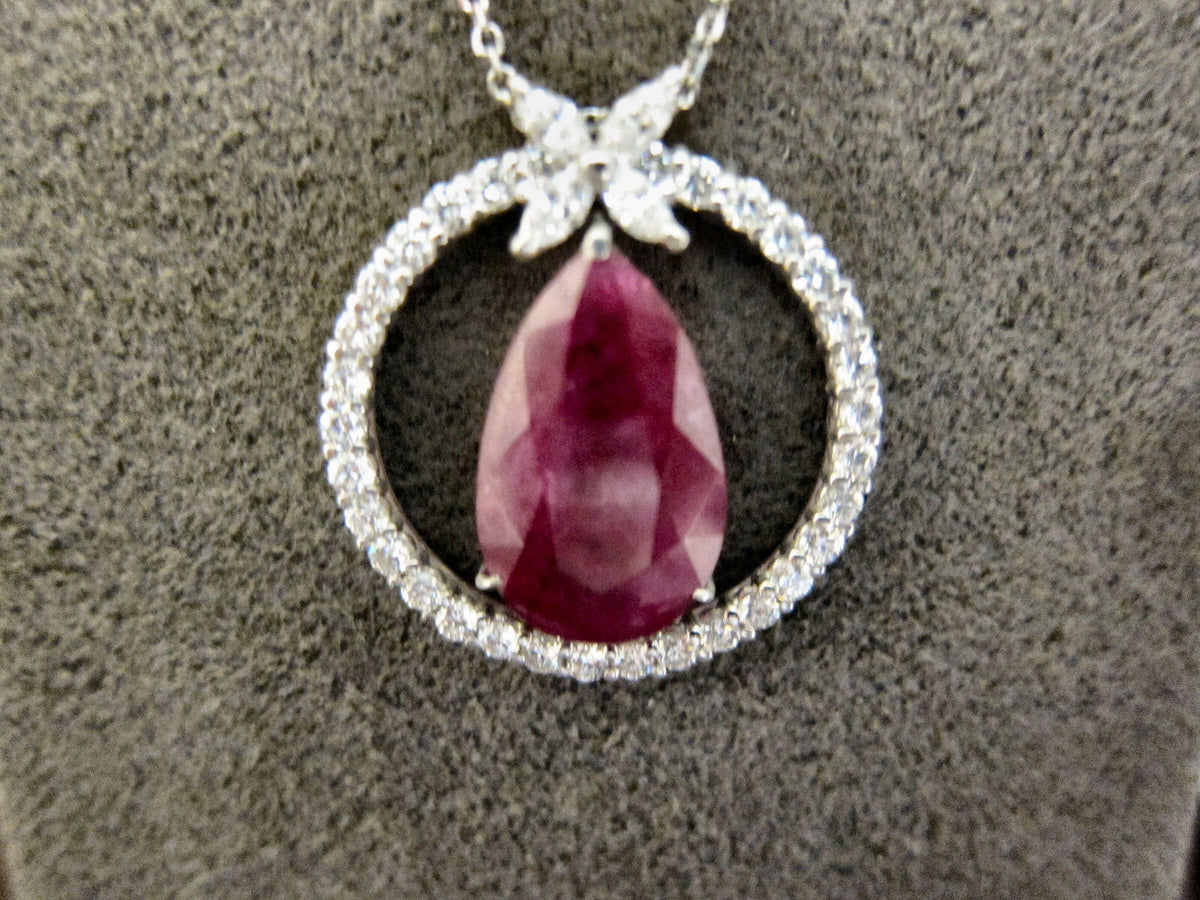 RUBY PEAR SHAPE PENDANT SET WITH ROUND DIAMOND FOUR MARQUISE SHAPE SET AROUND