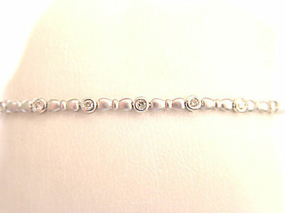 16 ROUND BRILLIANT CUT DIAMONDS BEZEL SET IN BRUSHED