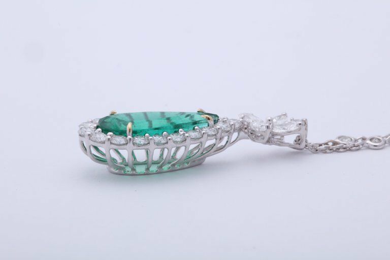 Emerald and diamond pendant. 5.23 carat green emerald lariette diamond necklace