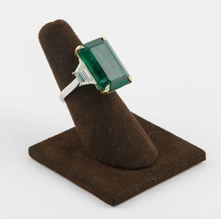 GIA certified 18.83 carat emerald set along 2.08 carat of side diamonds