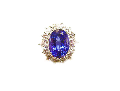 3.78 CT TANZANITE OVAL OVAL CUT SET WITH 12 ROUND BRILLIANT CUT DIAMONDS 18 K
