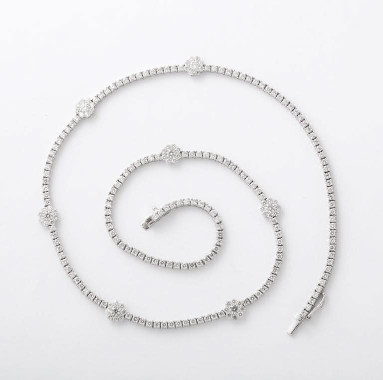 https://a.1stdibscdn.com/flower-diamond-tennis-necklace-for-sale-picture-4/j_415/j_216141721705596939551/6R1A0180_master.jpg?width=768
