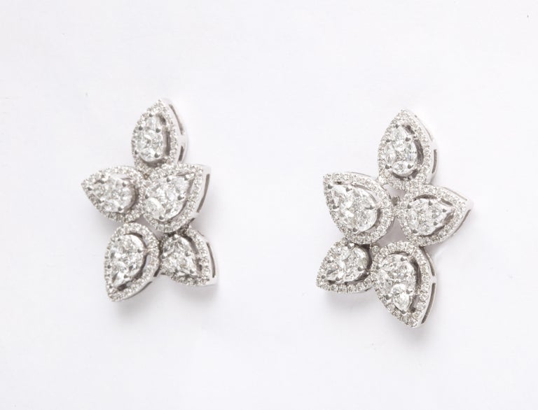 https://a.1stdibscdn.com/diamond-cluster-earrings-for-sale-picture-5/j_415/j_140275121637953079559/6R1A1270_master.jpg?width=768